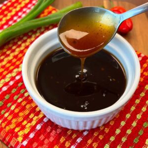 asian food solution sauce in a white bowl on a colorful table